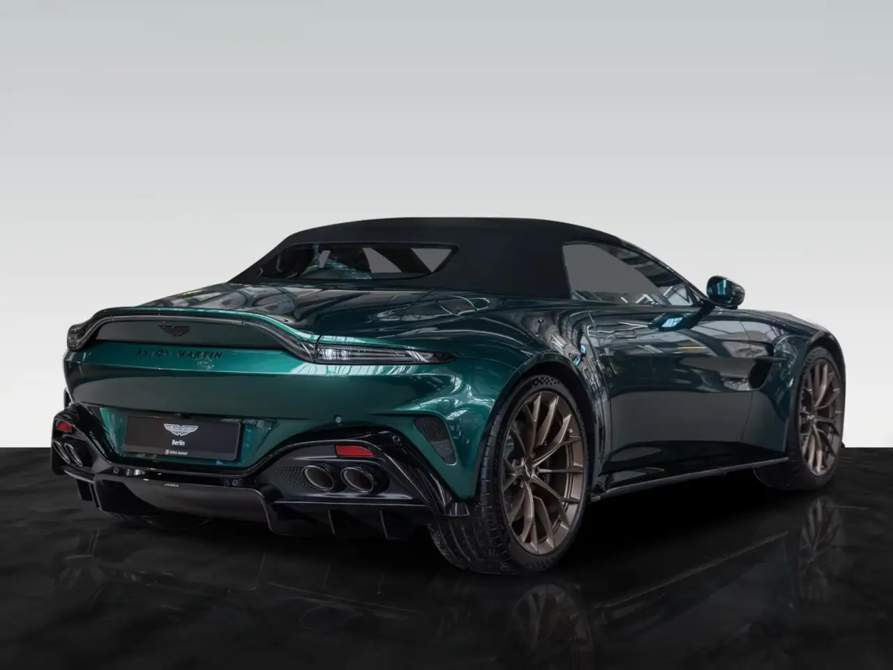 Aston Martin Vantage V8 Spider 2026, rear view — Sports Car Rental Germany, Germany. Top down through Alpine curves before sunset