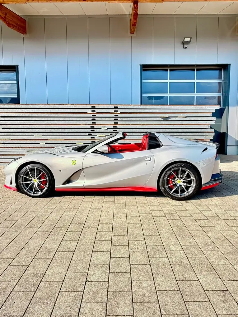 Ferrari 812 GTS 2024 — Sports Car Rental Germany, Germany. Offenes Fahren für kurvige Landstraßen bei Sonnenuntergang
