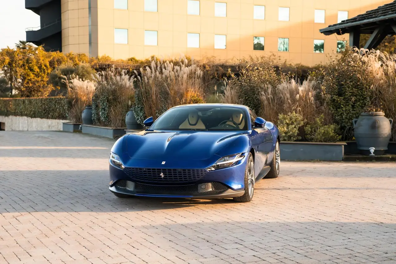 Ferrari Roma 2025 — Sports Car Rental Germany, Germany. Kurvenreiche Passstraßen, sanftes Cabrio-Gleiten am Abend