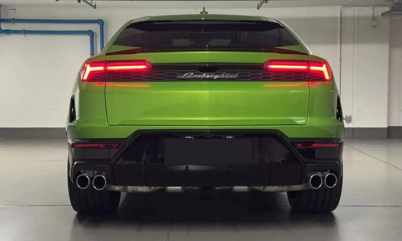 Lamborghini Urus SE 2026, rear view — Sports Car Rental Germany, Germany. Autobahn mornings, mountain curves, effortless hybrid power