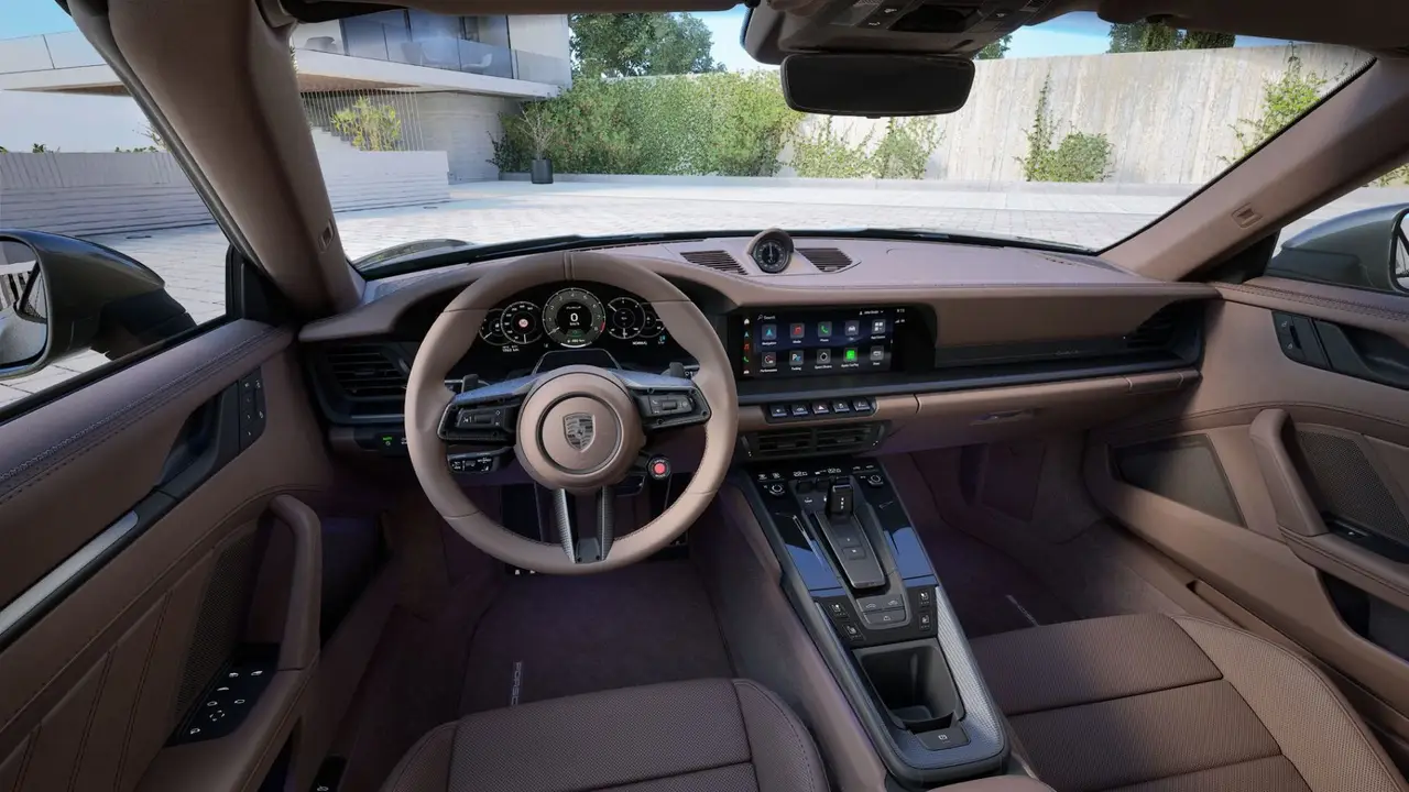 Porsche 911 992 Carrera Turbo S Cabrio 2026, rear view — Sports Car Rental Germany, Germany. Top down for winding roads and open skies