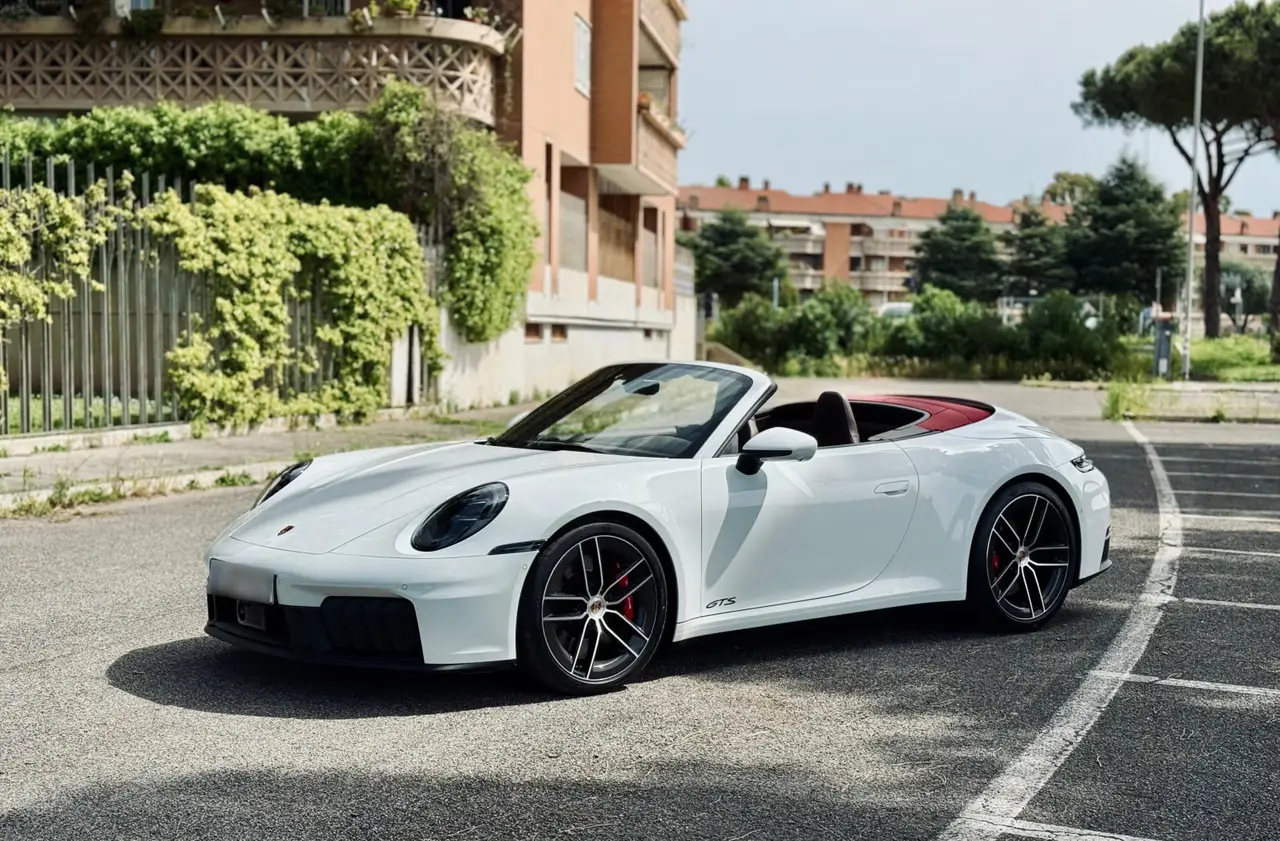 Porsche 992.2 Carrera 4 GTS Cabrio 2025 — Sports Car Rental Germany, Germany. Top down for Alpine passes at golden hour