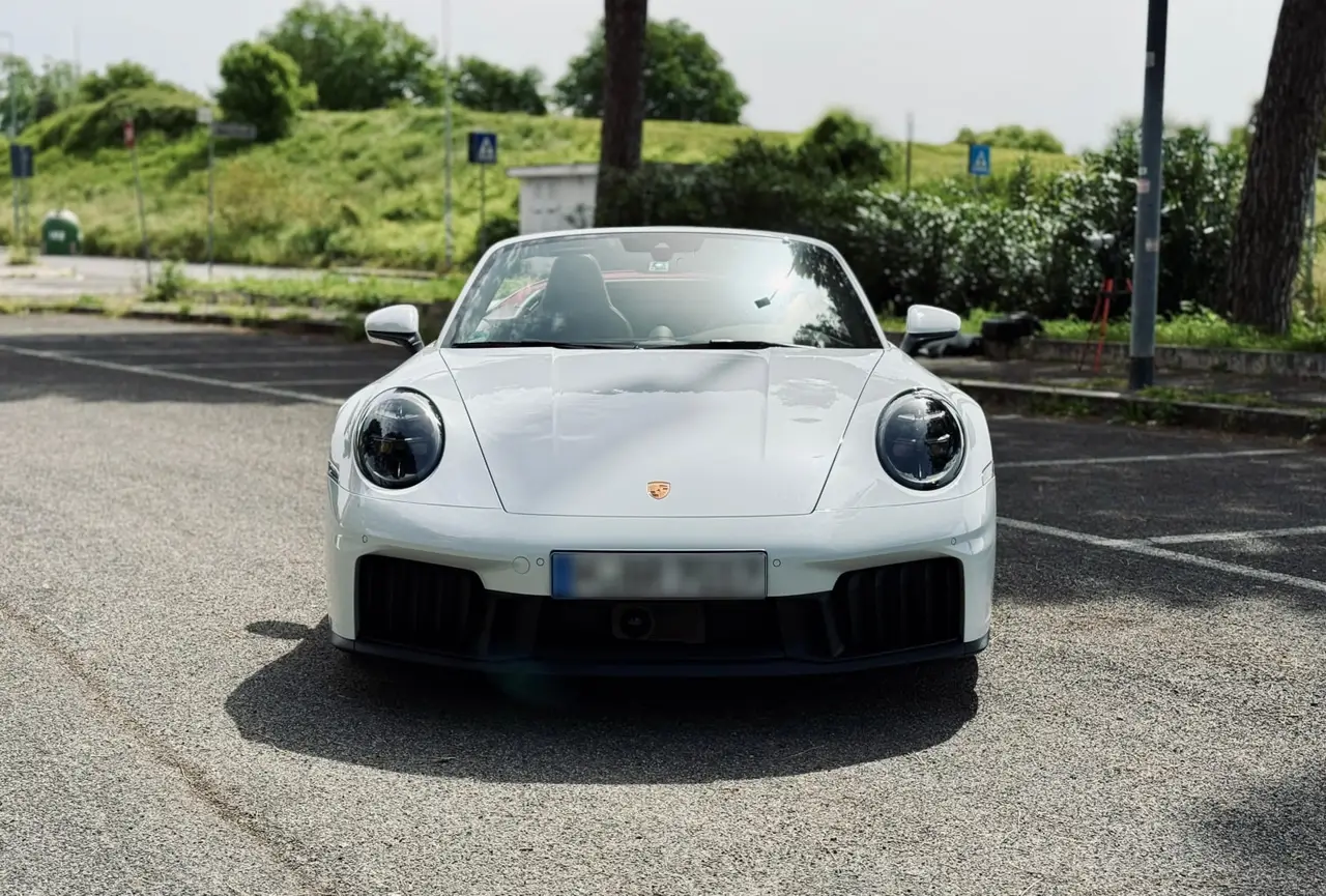 Porsche 992.2 Carrera 4 GTS Cabrio 2025, exterior — Sports Car Rental Germany, Germany. Top down for Alpine passes at golden hour