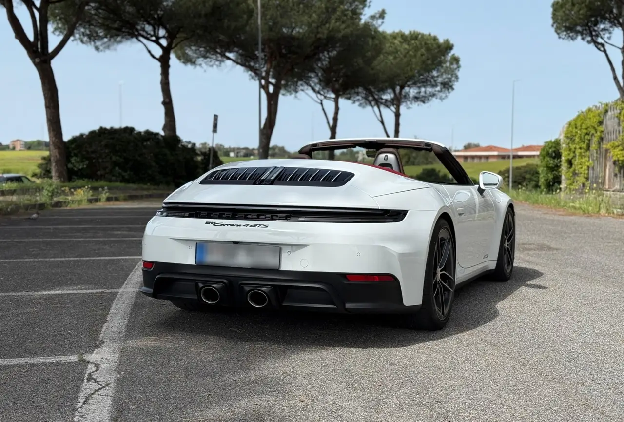 Porsche 992.2 Carrera 4 GTS Cabrio 2025, rear view — Sports Car Rental Germany, Germany. Top down for Alpine passes at golden hour