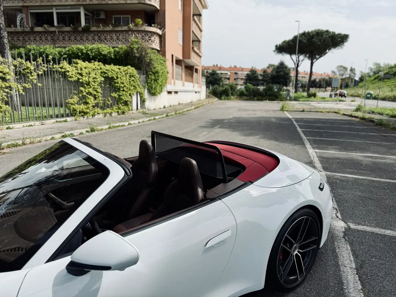 Porsche 992.2 Carrera 4 GTS Cabrio 2025, exterior — Sports Car Rental Germany, Germany. Top down for Alpine passes at golden hour